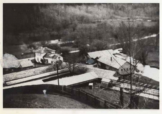 Aerial view of a the fur farm that turned into Farmer Creek Marketplace as it is today.